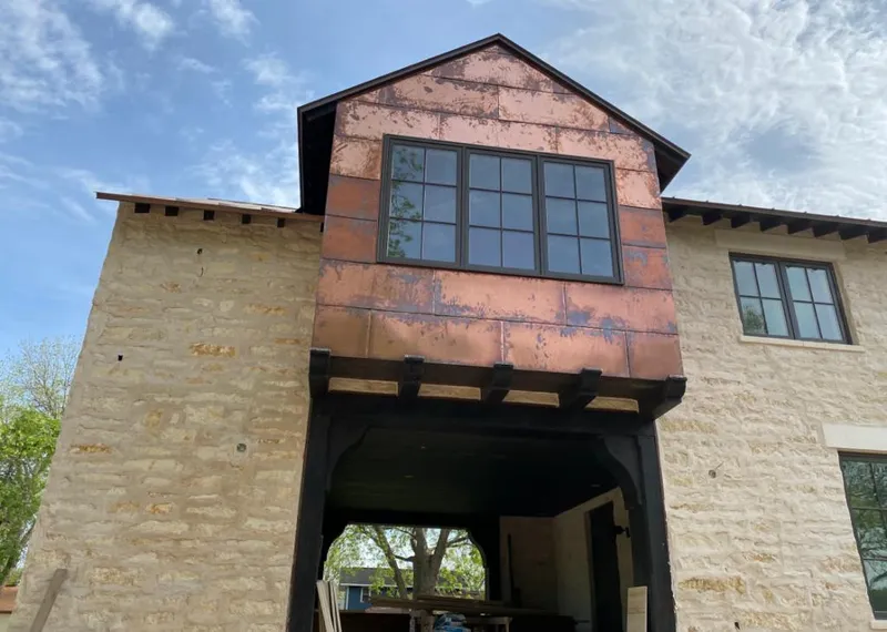 Copper metal panel facade on a stone building for Skylight Installation in Xenia